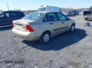 ✅ 2002 Ford Focus LX • VIN: 1FAFP33P42W289681 • Lot: 41989506. Wystawiony na IAAI z przebiegiem 128 070 mil. Bezpłatny archiwum sprzedaży aukcyjnych z USA i szczegółowy raport historii pojazdu na DreamBid. Zdjęcie 4.