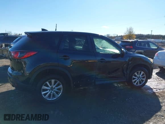 ✅ 2016 Mazda CX-5 Touring • VIN: JM3KE4CY8G0653406 • Lot: 43730001. Listed on IAAI with 79,279 mi. Free auction sales archive from the USA and detailed vehicle history report at DreamBid. Image 13.