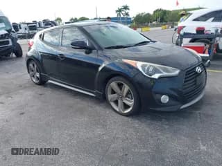 ✅ 2013 Hyundai Veloster Turbo • VIN: KMHTC6AE6DU085390 • Lot: 42032699. Listed on IAAI with 122,483 mi. Free auction sales archive from the USA and detailed vehicle history report at DreamBid. Image 1.