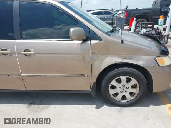 ✅ 2003 Honda Odyssey EX-L • VIN: 5FNRL18903B050071 • Lot: 42720392. Wystawiony na IAAI z przebiegiem 153 552 mil. Bezpłatny archiwum sprzedaży aukcyjnych z USA i szczegółowy raport historii pojazdu na DreamBid. Zdjęcie 6.