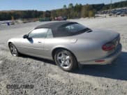 ✅ 1999 Jaguar XK • VIN: SAJGX2041XC040090 • Lot: 82702205. Listed on Copart with Not provided. Free auction sales archive from the USA and detailed vehicle history report at DreamBid. Image 2.