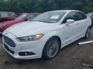 ✅ 2013 Ford Fusion Titanium Hybrid • VIN: 3FA6P0RU6DR315585 • Lot: 42598359. Listed on IAAI with 153,669 mi. Free auction sales archive from the USA and detailed vehicle history report at DreamBid. Image 2.