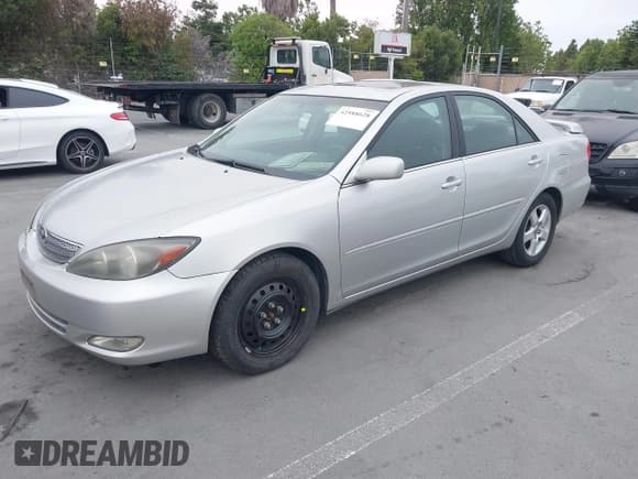 ✅ 2004 Toyota Camry LE • VIN: 4T1BE32KX4U879138 • Lot: 42588628. Listed on IAAI with 218,538 mi. Free auction sales archive from the USA and detailed vehicle history report at DreamBid. Image 2.