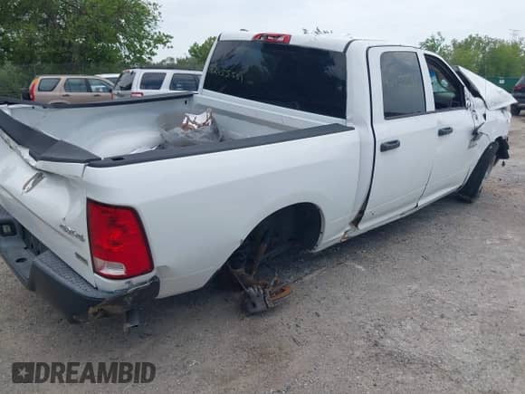 2014 Ram 1500 Tradesman with VIN 1C6RR7KGXES324124, listed as a IAAI auction lot 42455561 with 94,176 mi miles and . Bid and sale history available at DreamBid. Image 4.