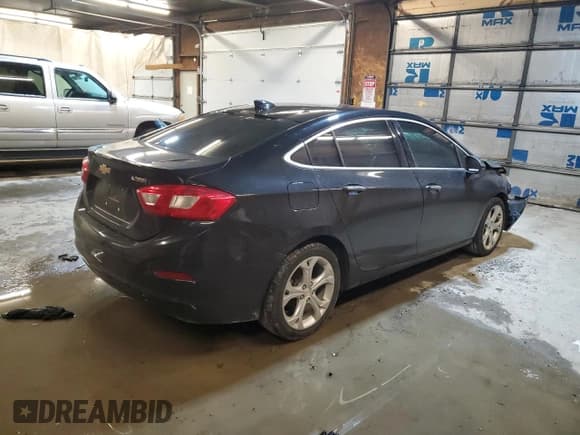✅ 2017 Chevrolet Cruze Premier • VIN: 1G1BF5SM5H7105472 • Lot: 36927923. Listed on Copart with 105,827 mi. Free auction sales archive from the USA and detailed vehicle history report at DreamBid. Image 3.