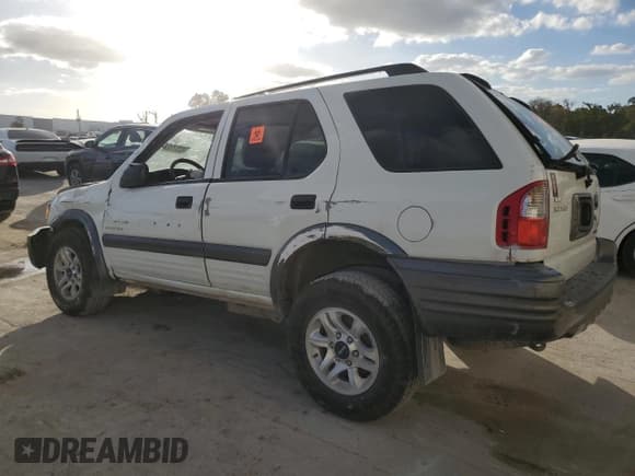 ✅ 2004 Isuzu Rodeo S • VIN: 4S2CK58Y244309017 • Lot: 83303294. Listed on Copart with 121,723 mi. Free auction sales archive from the USA and detailed vehicle history report at DreamBid. Image 2.