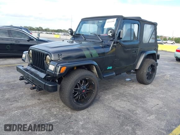 ✅ 1997 Jeep Wrangler SE • VIN: 1J4FY29P4VP469163 • Lot: 43611180. Listed on IAAI with 172,532 mi. Free auction sales archive from the USA and detailed vehicle history report at DreamBid. Image 2.