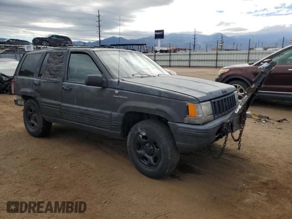 ✅ 1994 Jeep Grand Cherokee Laredo • VIN: 1J4GZ58S5RC351922 • Lot: 86131305. Listed on Copart with 200,941 mi. Free auction sales archive from the USA and detailed vehicle history report at DreamBid. Image 4.