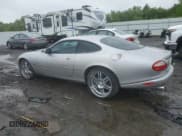 ✅ 2000 Jaguar XK • VIN: SAJJA41B6YPA01802 • Lot: 57146745. Listed on Copart with 32,208 mi. Free auction sales archive from the USA and detailed vehicle history report at DreamBid. Image 2.