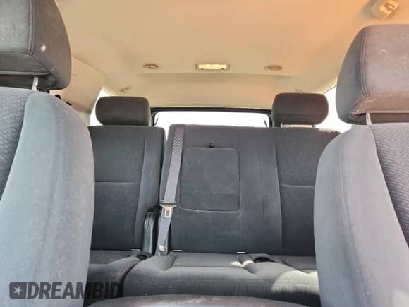 2007 Chevrolet Tahoe LS z VIN 1GNFC13067J203487, wystawiony jako Copart lot #69464065 z przebiegiem 239 918 mil mil oraz Szkoda całkowita • Salvage title. Historia ofert i sprzedaży dostępna na DreamBid. Obrazek 10.