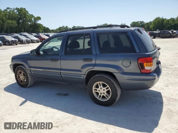 ✅ 2002 Jeep Grand Cherokee Laredo • VIN: 1J4GW48N72C252067 • Lot: 57414455. Listed on Copart with 133,429 mi. Free auction sales archive from the USA and detailed vehicle history report at DreamBid. Image 2.