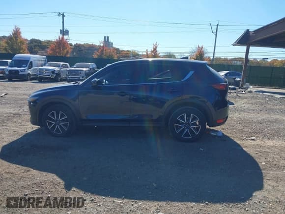 ✅ 2018 Mazda CX-5 Grand Touring • VIN: JM3KFBDM6J0473734 • Лот: 43536049. Опубликован ранее на IAAI с пробегом 124 488 миль. Бесплатный доступ к архиву аукционных продаж из США и подробный отчёт об истории автомобиля на DreamBid. Изображение 14.