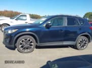 ✅ 2016 Mazda CX-5 Grand Touring • VIN: JM3KE2DY5G0715623 • Lot: 43582561. Wystawiony na IAAI z przebiegiem 166 935 mil. Bezpłatny archiwum sprzedaży aukcyjnych z USA i szczegółowy raport historii pojazdu na DreamBid. Zdjęcie 14.