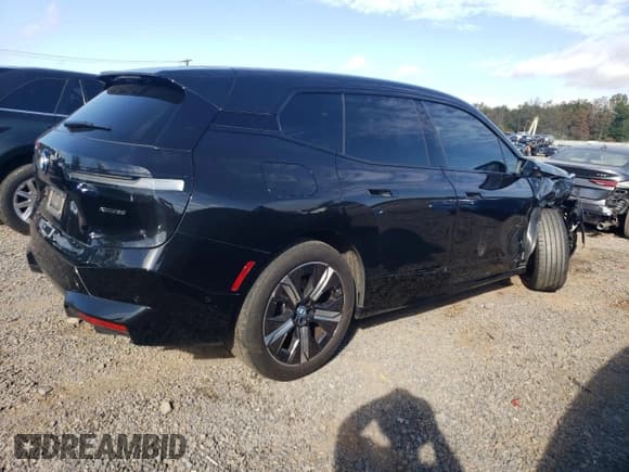 ✅ 2024 BMW iX xDrive50 • VIN: WB523CF08RCR00371 • Лот: 85160785. Опубликован ранее на Copart с пробегом 27 083 миль. Бесплатный доступ к архиву аукционных продаж из США и подробный отчёт об истории автомобиля на DreamBid. Изображение 3.