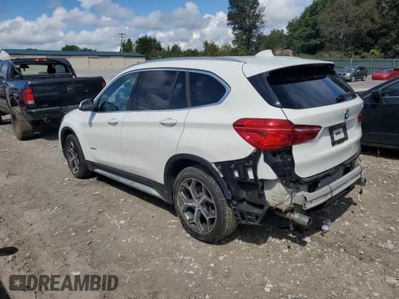 ✅ 2018 BMW X1 xDrive28i • VIN: WBXHT3C34J5F89498 • Lot: 84041505. Listed on Copart with 74,145 mi. Free auction sales archive from the USA and detailed vehicle history report at DreamBid. Image 2.