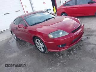✅ 2006 Hyundai Tiburon GT • VIN: KMHHN65FX6U229156 • Лот: 42082179. Опубликован ранее на IAAI с пробегом 172 207 миль. Бесплатный доступ к архиву аукционных продаж из США и подробный отчёт об истории автомобиля на DreamBid. Изображение 1.