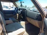 ✅ 1999 Jeep Cherokee SE • VIN: 1J4FF28S4XL592788 • Lot: 42560002. Listed on IAAI with 189,258 mi. Free auction sales archive from the USA and detailed vehicle history report at DreamBid. Image 5.