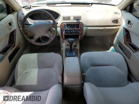 ✅ 2000 Mitsubishi Galant ES • VIN: 4A3AA46G1YE023862 • Lot: 61449105. Wystawiony na Copart z przebiegiem 206 364 mil. Bezpłatny archiwum sprzedaży aukcyjnych z USA i szczegółowy raport historii pojazdu na DreamBid. Zdjęcie 8.