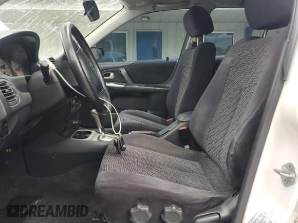 ✅ 2003 Mazda Protege • VIN: JM1BJ245231220634 • Lot: 69937275. Listed on Copart with 145,413 mi. Free auction sales archive from the USA and detailed vehicle history report at DreamBid. Image 7.