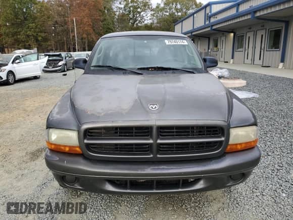 2002 Dodge Dakota z VIN 1B7GL12X22S589971, wystawiony jako Copart lot #79740174 z przebiegiem 183 718 mil mil oraz Czysty tytuł • Clean title. Historia ofert i sprzedaży dostępna na DreamBid. Obrazek 5.