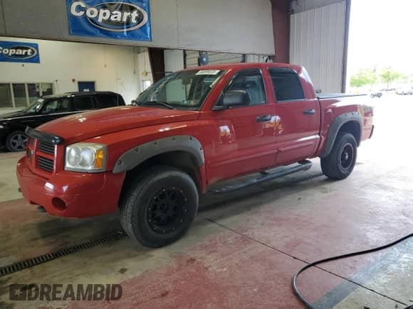 2007 Dodge Dakota SLT with VIN 1D7HW48N67S103906, listed as a Copart auction lot 58899035 with 115,650 mi miles and Salvage title. Bid and sale history available at DreamBid. Image 1.