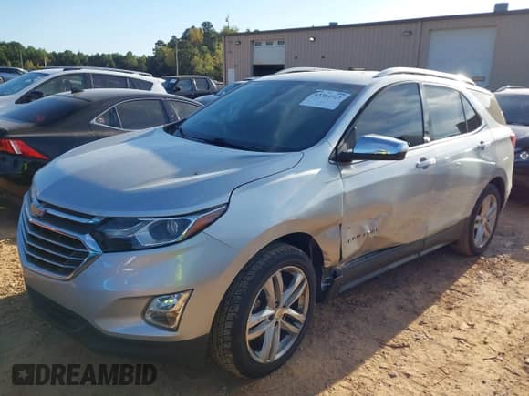 2018 Chevrolet Equinox Premier z VIN 3GNAXNEX5JS509702, wystawiony jako IAAI lot #43364923 z przebiegiem 152 731 mil mil oraz . Historia ofert i sprzedaży dostępna na DreamBid. Obrazek 2.