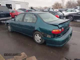 2000 Chevrolet Malibu LS z VIN 1G1NE52J4Y6135123, wystawiony jako IAAI lot #41162955 z przebiegiem 164 327 mil mil oraz . Historia ofert i sprzedaży dostępna na DreamBid. Obrazek 3.