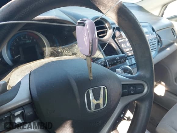 ✅ 2011 Honda Insight EX • VIN: JHMZE2H75BS005593 • Лот: 43400718. Опубликован ранее на IAAI с пробегом 235 247 миль. Бесплатный доступ к архиву аукционных продаж из США и подробный отчёт об истории автомобиля на DreamBid. Изображение 11.