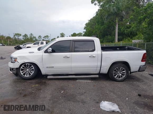 ✅ 2021 Ram 1500 Laramie • VIN: 1C6RREJT5MN628655 • Lot: 42734346. Listed on IAAI with 104,116 mi. Free auction sales archive from the USA and detailed vehicle history report at DreamBid. Image 14.