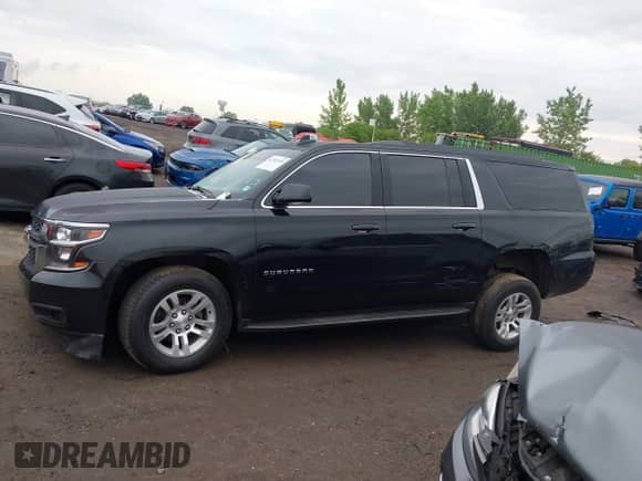 2018 Chevrolet Suburban LS z VIN 1GNSKGKCXJR264351, wystawiony jako IAAI lot #42365399 z przebiegiem 69 704 mil mil oraz . Historia ofert i sprzedaży dostępna na DreamBid. Obrazek 14.