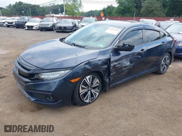 ✅ 2018 Honda Civic EX-T • VIN: JHMFC1F34JX037438 • Lot: 42887459. Listed on IAAI with 107,302 mi. Free auction sales archive from the USA and detailed vehicle history report at DreamBid. Image 2.