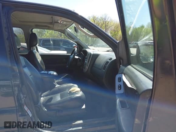 ✅ 2003 Ford Escape Limited • VIN: 1FMCU94103KB90251 • Lot: 42034006. Listed on IAAI with 225,566 mi. Free auction sales archive from the USA and detailed vehicle history report at DreamBid. Image 5.