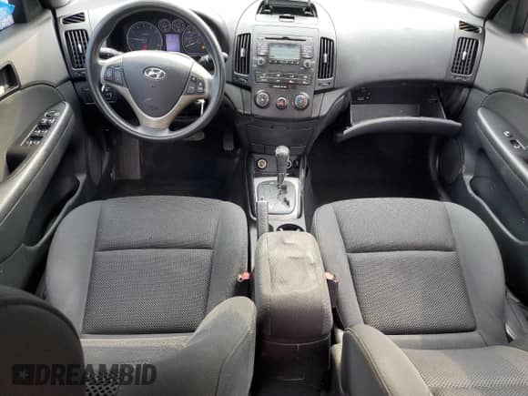 2010 Hyundai Elantra SE z VIN KMHDC8AE6AU059612, wystawiony jako Copart lot #67145645 z przebiegiem 162 561 mil mil oraz Szkoda całkowita • Salvage title. Historia ofert i sprzedaży dostępna na DreamBid. Obrazek 8.