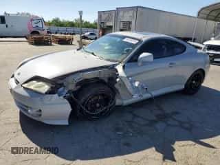 2003 Hyundai Tiburon GT с VIN KMHHN65F73U101856, выставлен на аукционе Copart как лот 64248815 с пробегом 59 622 миль миль и Списание • Salvage title. История ставок и продаж доступна на DreamBid. Изображение 1.