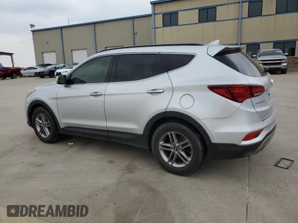 ✅ 2018 Hyundai Santa Fe 2.4L • VIN: 5XYZUDLB5JG525082 • Лот: 56038194. Опубликован ранее на Copart с пробегом Не указан. Бесплатный доступ к архиву аукционных продаж из США и подробный отчёт об истории автомобиля на DreamBid. Изображение 2.
