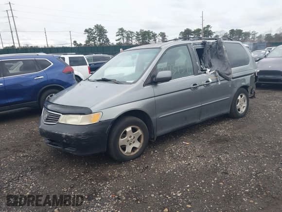 ✅ 2001 Honda Odyssey EX • VIN: 2HKRL18661H618490 • Lot: 43773737. Listed on IAAI with 141,985 mi. Free auction sales archive from the USA and detailed vehicle history report at DreamBid. Image 2.