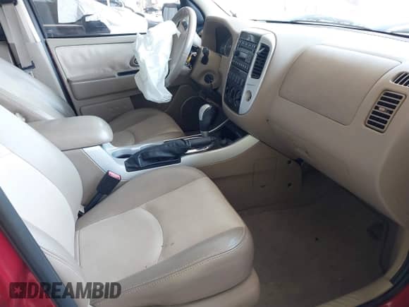 2006 Mercury Mariner Luxury z VIN 4M2YU56186KJ03260, wystawiony jako IAAI lot #42010188 z przebiegiem 103 673 mil mil oraz . Historia ofert i sprzedaży dostępna na DreamBid. Obrazek 5.