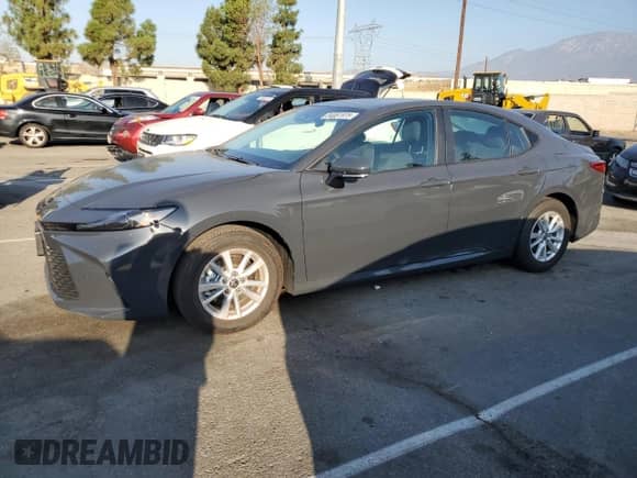 2025 Toyota Camry LE with VIN 4T1DAACK8SU067003, listed as a Copart auction lot 84061975 with 9,394 mi miles and Salvage title. Bid and sale history available at DreamBid. Image 1.