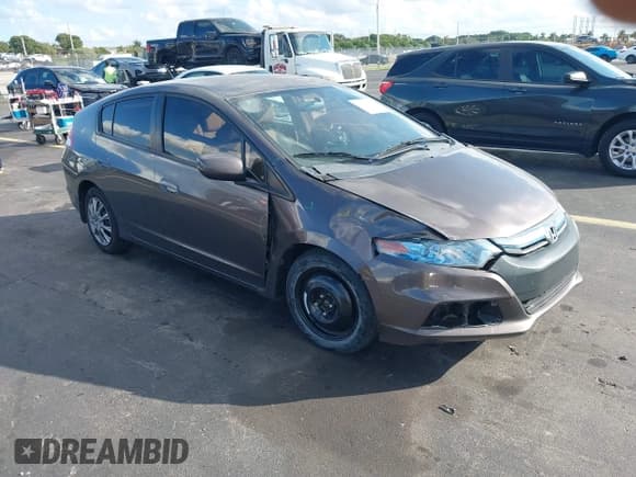 ✅ 2013 Honda Insight LX • VIN: JHMZE2H58DS001247 • Lot: 43801615. Listed on IAAI with 113,454 mi. Free auction sales archive from the USA and detailed vehicle history report at DreamBid. Image 1.