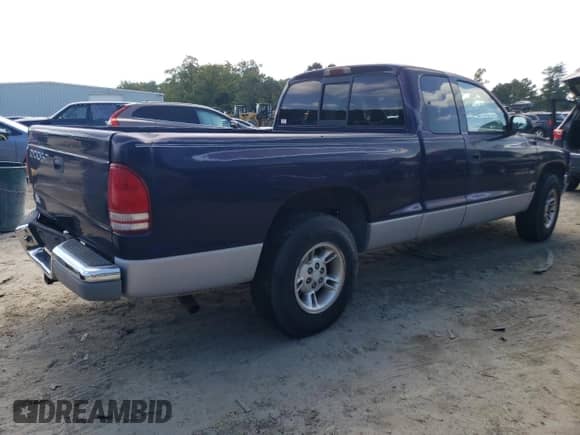 1999 Dodge Dakota SLT z VIN 1B7GL22X6XS225162, wystawiony jako Copart lot #74579884 z przebiegiem 162 714 mil mil oraz Czysty tytuł • Clean title. Historia ofert i sprzedaży dostępna na DreamBid. Obrazek 3.