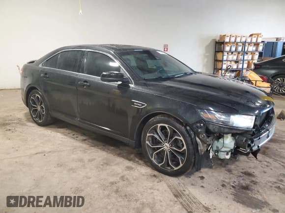 ✅ 2015 Ford Taurus SHO • VIN: 1FAHP2KT8FG153345 • Lot: 61566365. Listed on Copart with 174,909 mi. Free auction sales archive from the USA and detailed vehicle history report at DreamBid. Image 4.