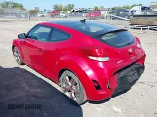 2012 Hyundai Veloster w/Gray Int z VIN KMHTC6AD3CU021409, wystawiony jako IAAI lot #43181633 z przebiegiem 149 988 mil mil oraz . Historia ofert i sprzedaży dostępna na DreamBid. Obrazek 3.