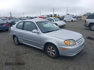2005 Hyundai Accent GLS z VIN KMHCG35C85U362103, wystawiony jako IAAI lot #43453189 z przebiegiem 116 936 mil mil oraz . Historia ofert i sprzedaży dostępna na DreamBid. Obrazek 1.