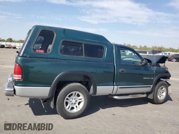 2001 Dodge Dakota Sport z VIN 1B7GG26N81S262671, wystawiony jako Copart lot #71080995 z przebiegiem 145 480 mil mil oraz Szkoda całkowita • Salvage title. Historia ofert i sprzedaży dostępna na DreamBid. Obrazek 3.