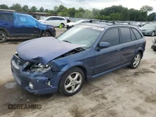 ✅ 2002 Mazda Protege • VIN: JM1BJ245321502702 • Lot: 64486415. Listed on Copart with 355,430 mi. Free auction sales archive from the USA and detailed vehicle history report at DreamBid. Image 1.