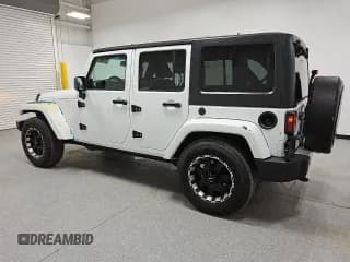 ✅ 2014 Jeep Wrangler Unlimited Sahara • VIN: 1C4BJWEG9EL206986 • Лот: 65411765. Опубликован ранее на Copart с пробегом 125 747 миль. Бесплатный доступ к архиву аукционных продаж из США и подробный отчёт об истории автомобиля на DreamBid. Изображение 2.