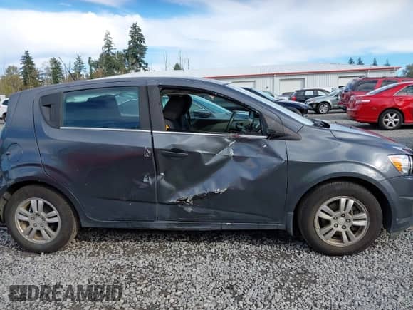 2013 Chevrolet Sonic LT with VIN 1G1JC6SG2D4148084, listed as a IAAI auction lot 43459236 with 94,963 mi miles and . Bid and sale history available at DreamBid. Image 13.