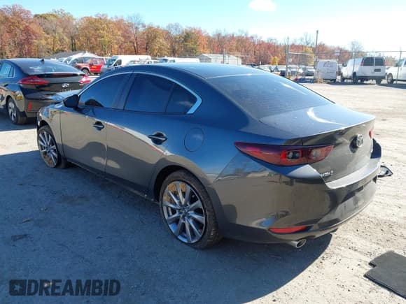 ✅ 2023 Mazda 3 S Select • VIN: 3MZBPABMXPM358463 • Lot: 43643544. Listed on IAAI with 56,857 mi. Free auction sales archive from the USA and detailed vehicle history report at DreamBid. Image 3.