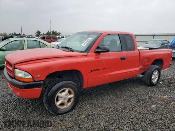1998 Dodge Dakota SLT z VIN 1B7GG22X1WS598712, wystawiony jako Copart lot #76095004 z przebiegiem 196 012 mil mil oraz Szkoda całkowita • Salvage title. Historia ofert i sprzedaży dostępna na DreamBid. Obrazek 1.