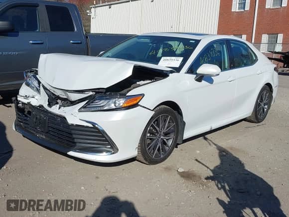 2022 Toyota Camry Hybrid XLE with VIN 4T1F31AK4NU599424, listed as a IAAI auction lot 40839336 with 68,918 mi miles and . Bid and sale history available at DreamBid. Image 2.